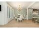 An elegant dining area featuring a round table, wainscoting, and a chandelier at 39 Ivy Gates Ne, Atlanta, GA 30342