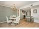 Open floor plan with dining area featuring a stylish chandelier and access to the kitchen at 39 Ivy Gates Ne, Atlanta, GA 30342