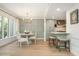 Dining area with modern chandelier, open floor plan with a breakfast bar and natural lighting at 39 Ivy Gates Ne, Atlanta, GA 30342