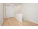 Bright hallway with hardwood floors, closet and clean, white walls, leading to other areas of the home at 39 Ivy Gates Ne, Atlanta, GA 30342
