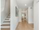 Bright hallway features hardwood floors, staircase, coat closet, and access to living areas at 39 Ivy Gates Ne, Atlanta, GA 30342