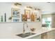 Kitchen with decorative wall art, stainless steel sink, and modern faucet at 39 Ivy Gates Ne, Atlanta, GA 30342