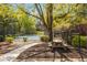 Enjoy the outdoors in this picnic area with a wooden table, set amidst a lush, landscaped environment at 39 Ivy Gates Ne, Atlanta, GA 30342