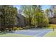 Enjoy a game of tennis on the community's well-maintained court, with convenient seating and lush landscaping at 39 Ivy Gates Ne, Atlanta, GA 30342