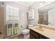 Clean bathroom with a vanity, toilet, shower, and medicine cabinet at 4520 Windsor Oaks Dr, Marietta, GA 30066