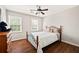 Comfortable bedroom with hardwood floors, two windows, and plenty of natural light at 4520 Windsor Oaks Dr, Marietta, GA 30066