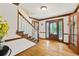 Bright foyer features hardwood floors, staircase, and an elegant front door with stained glass at 4520 Windsor Oaks Dr, Marietta, GA 30066