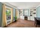 Bright home office with built-in bookshelves, cabinets, and natural light from two windows at 4520 Windsor Oaks Dr, Marietta, GA 30066