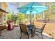 Outdoor patio area perfect for entertaining, featuring a grill, dining table, and shade umbrella at 4520 Windsor Oaks Dr, Marietta, GA 30066