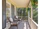Inviting porch with wicker furniture and lush green plants creates a relaxing outdoor space at 4520 Windsor Oaks Dr, Marietta, GA 30066