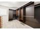 Large walk-in closet with dark-stained storage and shelving, plus a small window at 4520 Windsor Oaks Dr, Marietta, GA 30066