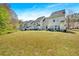 Large backyard view showing the rear of the townhome at 7112 Brookview Way, Riverdale, GA 30274