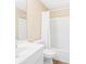 Bathroom featuring a white vanity, mirror and shower with white curtain at 7112 Brookview Way, Riverdale, GA 30274