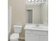 Bathroom featuring a white vanity and a large mirror at 7112 Brookview Way, Riverdale, GA 30274
