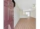 Bright living room features modern floors, fresh neutral paint and abundant natural light from the sliding doors at 7112 Brookview Way, Riverdale, GA 30274