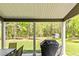 Covered patio overlooking the expansive backyard with mature trees and a storage shed at 719 Fairview Rd, Brooks, GA 30205