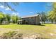 Expansive backyard featuring a covered porch and plenty of green space, great for outdoor activities and relaxation at 719 Fairview Rd, Brooks, GA 30205