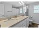 Bright bathroom with dual sinks, quartz countertops, and modern fixtures at 719 Fairview Rd, Brooks, GA 30205