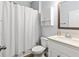 Bright bathroom featuring a shower/tub combo and a white vanity with a light countertop at 719 Fairview Rd, Brooks, GA 30205