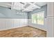 Bright dining room with modern chandelier, wainscoting and luxury vinyl plank flooring at 719 Fairview Rd, Brooks, GA 30205