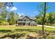 Attractive two-story gray home with a inviting front porch and curb appeal at 719 Fairview Rd, Brooks, GA 30205