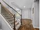 Inviting foyer with hardwood flooring and a staircase with carpeted steps at 719 Fairview Rd, Brooks, GA 30205