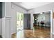 Inviting foyer featuring hardwood floors and an open view of the office and the front lawn at 719 Fairview Rd, Brooks, GA 30205
