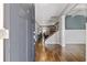 Spacious foyer with hardwood floors, offering a view of the staircase and the open-concept design at 719 Fairview Rd, Brooks, GA 30205