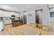 The kitchen features white cabinets, a stainless steel refrigerator, and a large island with a cooktop at 719 Fairview Rd, Brooks, GA 30205