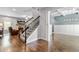 Elegant living room featuring hardwood floors, a fireplace, a staircase, and recessed lighting at 719 Fairview Rd, Brooks, GA 30205