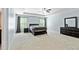 Spacious main bedroom with neutral paint, carpet, and a tray ceiling at 719 Fairview Rd, Brooks, GA 30205