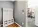 Mudroom with storage and bench area, leading to the garage and other interior spaces at 719 Fairview Rd, Brooks, GA 30205