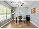 Comfortable office featuring a desk with a computer, a window and luxury vinyl plank flooring at 719 Fairview Rd, Brooks, GA 30205