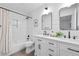 Stylish bathroom with double vanity, modern fixtures, and tiled shower at 912 Fairburn Nw Rd, Atlanta, GA 30331