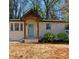 Charming bungalow with white brick and inviting front porch at 912 Fairburn Nw Rd, Atlanta, GA 30331