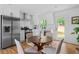 Eat-in kitchen boasts stainless steel appliances and backyard access at 912 Fairburn Nw Rd, Atlanta, GA 30331