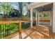 Outdoor deck with a ceiling fan and black aluminum railings, offering a great space for entertainment at 195 Childs Nw Dr, Atlanta, GA 30314