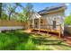 Charming home with a wooden deck and backyard perfect for outdoor relaxation and entertainment at 195 Childs Nw Dr, Atlanta, GA 30314