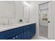 Modern bathroom featuring double vanity, quartz countertop, and stylish blue cabinets at 195 Childs Nw Dr, Atlanta, GA 30314