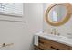 Half bathroom features a modern vanity, faucet, and mirror at 195 Childs Nw Dr, Atlanta, GA 30314