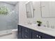 Bathroom with a dual sink vanity with white counter top and a tiled standing shower at 195 Childs Nw Dr, Atlanta, GA 30314