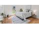 Sunlit bedroom with a door to the deck, adorned with neutral tones and stylish decor, inviting outdoor living at 195 Childs Nw Dr, Atlanta, GA 30314
