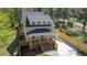 Inviting two-story home featuring a covered porch, ample parking, and manicured lawn at 195 Childs Nw Dr, Atlanta, GA 30314