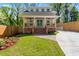 Charming two-story home with a well-maintained front yard and inviting brick steps leading to the covered porch at 195 Childs Nw Dr, Atlanta, GA 30314