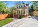 Charming two-story home with a well-maintained front yard and inviting brick steps leading to the covered porch at 195 Childs Nw Dr, Atlanta, GA 30314