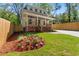 Charming two-story home with a well-maintained front yard and inviting brick steps leading to the covered porch at 195 Childs Nw Dr, Atlanta, GA 30314