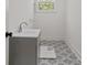 Laundry room with diamond patterned tile floor and window at 195 Childs Nw Dr, Atlanta, GA 30314
