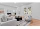 Bright living room with neutral-toned furniture, wood floors, and natural light from multiple windows at 195 Childs Nw Dr, Atlanta, GA 30314