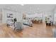Open-concept living space with hardwood floors, a cozy seating area, and a view into the kitchen and dining area at 195 Childs Nw Dr, Atlanta, GA 30314