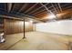 Unfinished basement with exposed pipes, beams and a white foundation, ready for customization at 2846 Spring Lake Dr, Buford, GA 30519